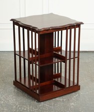 ANTIQUE EDWARDIAN REVOLVING BOOKCASE WITH A SERPENTINE SHAPED TOP