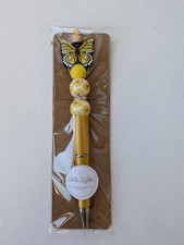Yellow butterfly decorated pen
