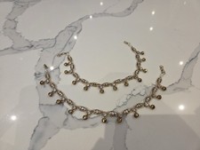 Traditional Indian anklet with delicate charms for a graceful ethnic touch.