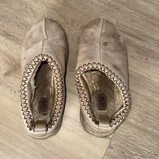Well worn women’s Ugg mules 