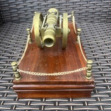 Vintage Brass Cannon On Wooden