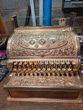 Old Brass National press-down Cash Register in working order. Clean & shiny. 