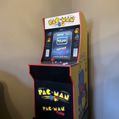 Pac man arcade machine with - man,