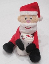 Santa soft toy holding