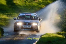 Photo 6x4 A car makes a splash