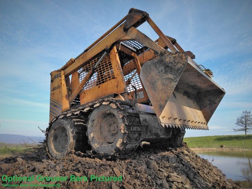 Skid steer loader over - skid,