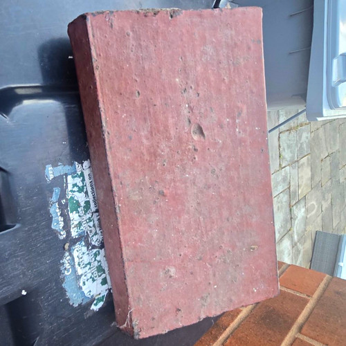 Red perforated clay building - red,