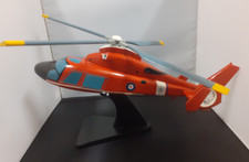 wooden red helicopter on stand