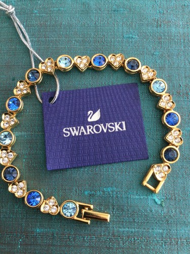 Genuine signed swarovski gold - genuine,