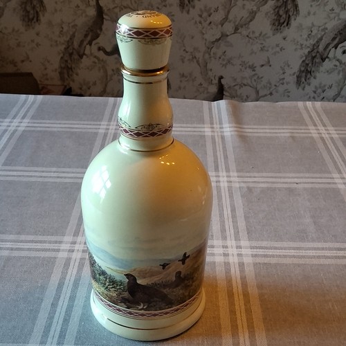 The famous grouse scotch - the,