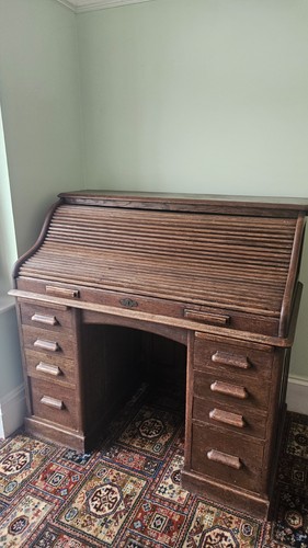 Antique wooden roll - top, desk