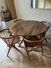 Mid-Century Teak Circular Dining Table Set with Four Chairs.