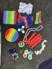 Bag Of Fidget Toys And 4 Pop It’s