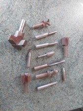12 used router cutters  + 54mm hinge hole cutter.