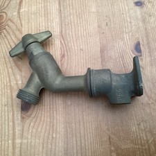 OLD BUT UNUSED BRASS OUTSIDE TAP WITH WALL FIXING 