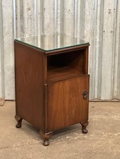 A 1940’s walnut bedside cabinet