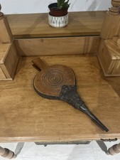A vintage wooden and leather fireplace bellows with a metal nozzle