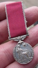 A PERIOD MINIATURE ER 11 BEM BRITISH EMPIRE MEDAL, SPINK MOUNTED.