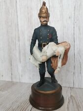VICTORIAN FIREMAN SAVED ORNAMENT ON WOODEN PLINTH