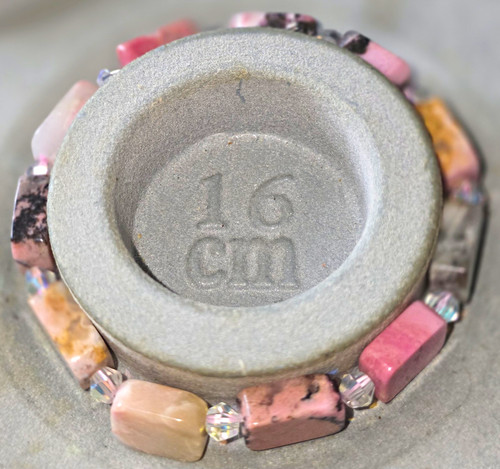 Rhodonite stone crystal - &,