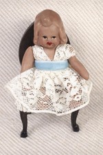 A Dolls House Size Doll From