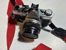 Olympus OM-2 with three lenses