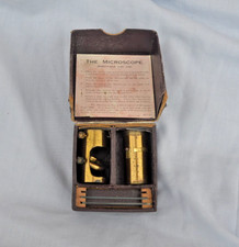 Small brass pocket microscope.