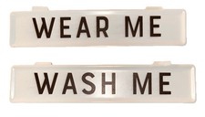 2 Tin Signs. 1 Wear Me & 1 Wash Me. Hangs On Shelf Or Clothes Basket. 8.5”x2”