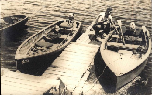 Man dock speedboats boats - man,