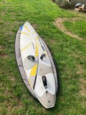 Fanatic Cross CX100 windsurf board, fin, and bag