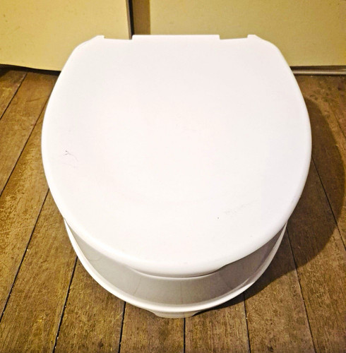 Raised toilet seat with - raised,