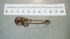 halstatt latene style  swirl bronze fibula with figure 8 spiral