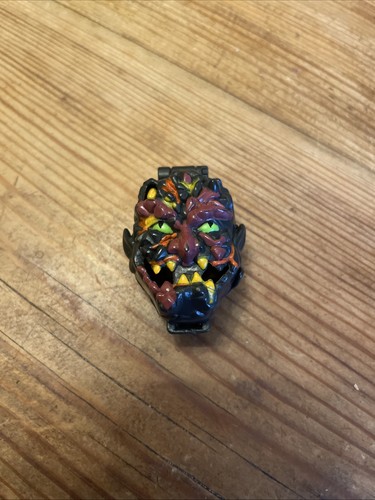 Mighty max shrunken head rock - max,