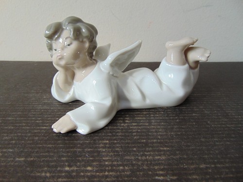Lladro reclining boy angel - boy, /