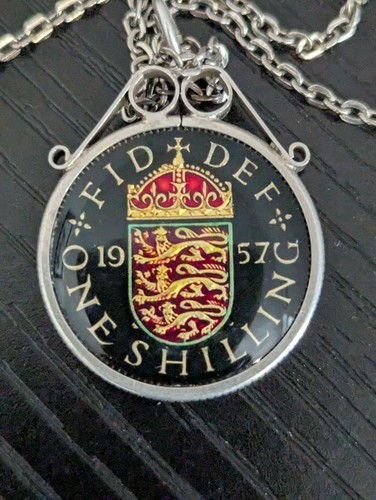 1957 enameled shilling coin - 1957,