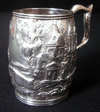 A solid silver child's mug