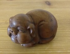 NETSUKE / LAUGHING PIG