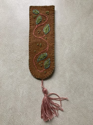 Hand embroidered tasseled book - embroidered,