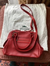 Longchamp red leather handbag, with handles and cross body detachable strap.