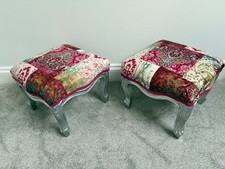 A pair of vintage footstools, freshly repainted and with new upholstery