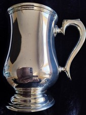 Silver plated barrel shaped tankard.  Just under 1 pint capacity.  