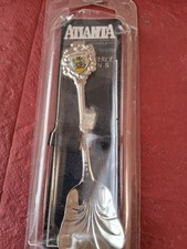 Spoons Commerative 7 and a
