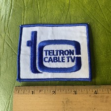 VINTAGE TELTRON CABLE TV TELEVISION PATCH NOS ADVERTISEMENT LOGO