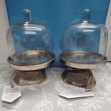 Glass covered cake stand with