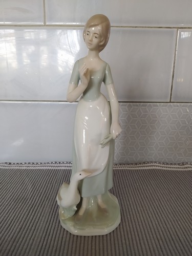 Lady with goose approx - goose, 10.5"