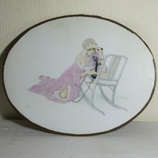 54cm Oval Glazed Raphael Kirchner Print of a Semi-Clad Young Lady on a Telephone