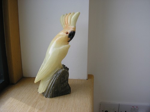 Hand carved alabaster cockatoo - hand,