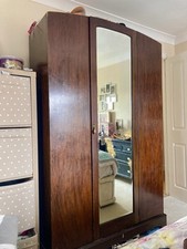 Dark Wooden Ornate wardrobe With Mirror And Hanging Space