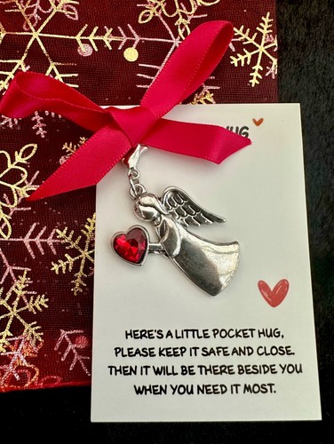 Winged angel holding red heart - angel,