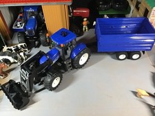 Bruder 1:16 New Holland T8040 Tractor with Front Loader and Tipper Trailer.